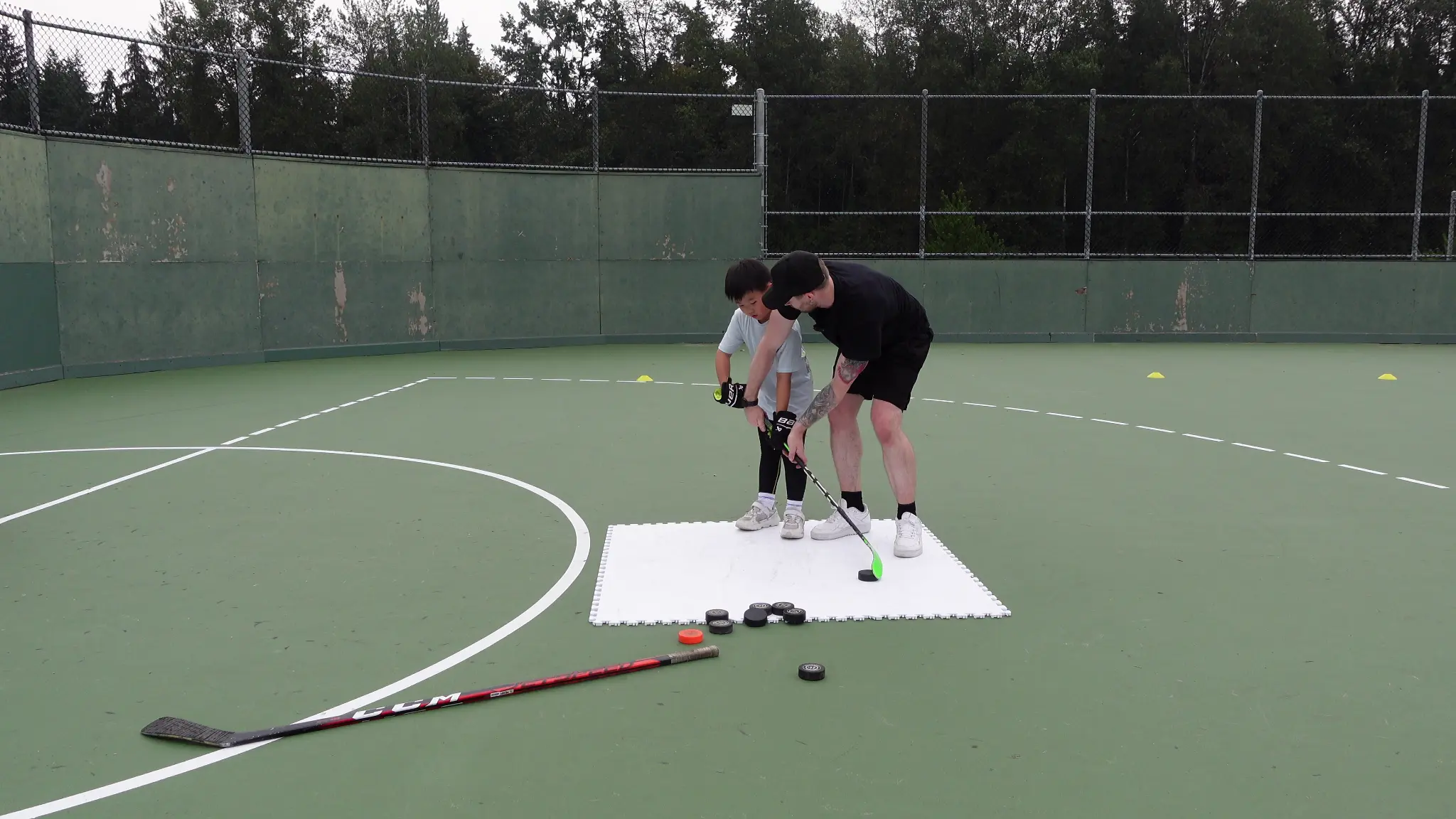 Grant coaching on the outdoor court