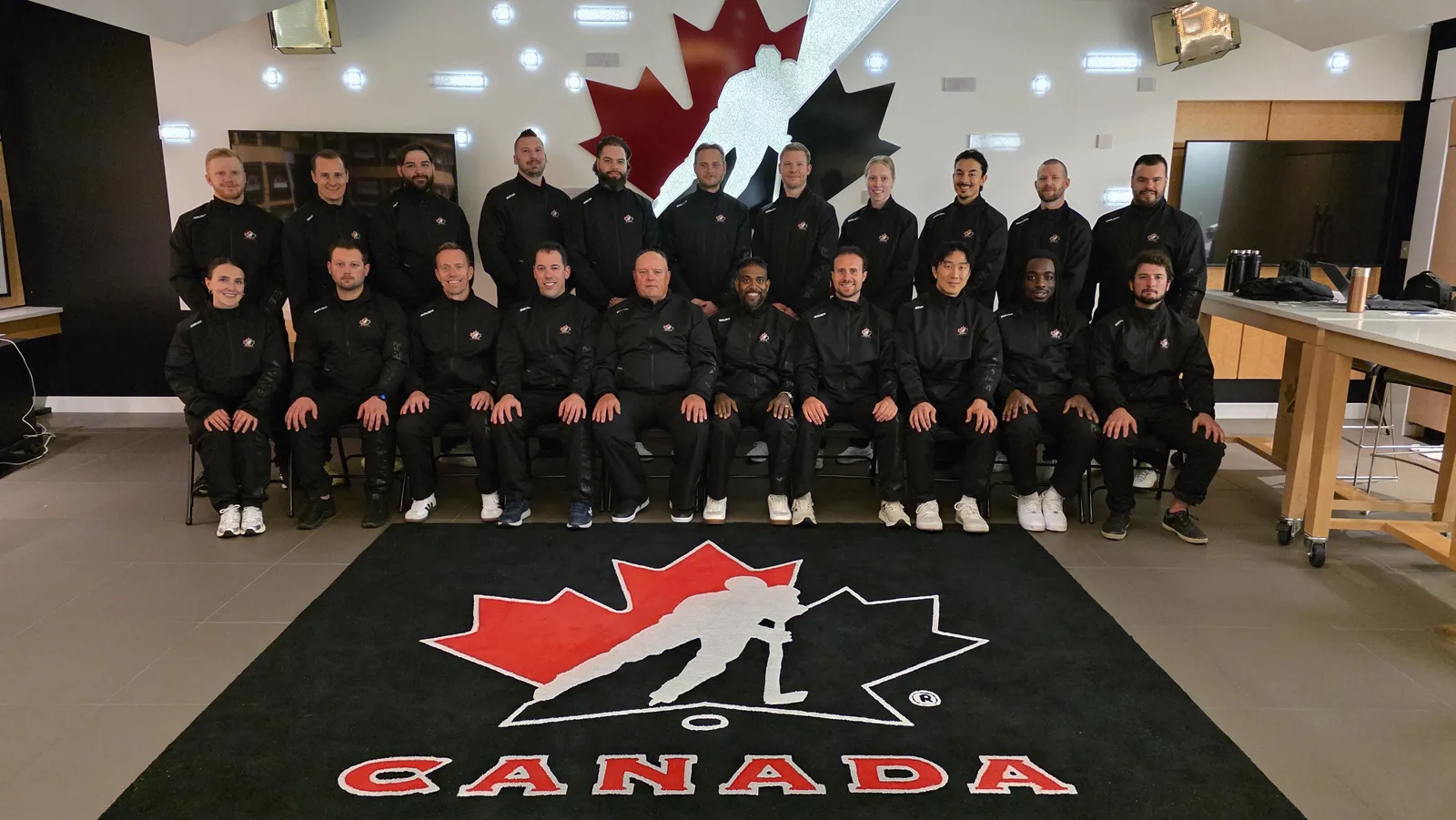 Grant Truesdell with fellow coaches at a Hockey Canada coaching seminar